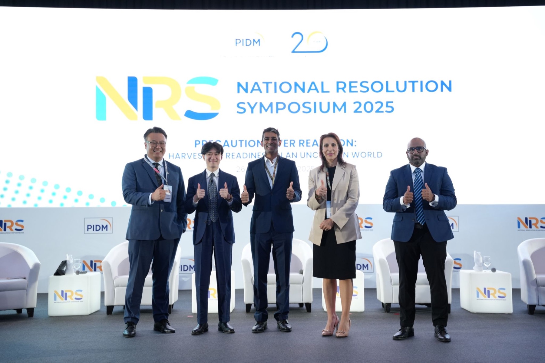 Gaurav Keerthi on stage at the National Resolution Symposium 2025.